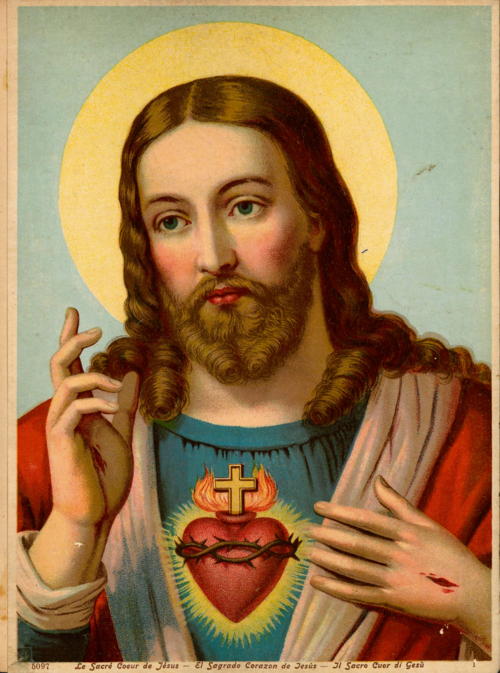 The Sacred Heart of Jesus, crowned with thorns and surmounted by a cross.