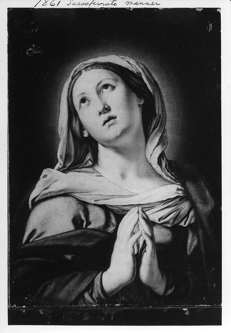 The Virgin in Prayer by Sassoferrato: Mary in a deep blue mantle with eyes lowered and hands folded.